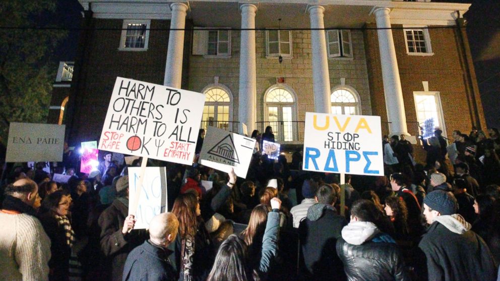 PHOTO: Protestors carry signs and chant slogans in front of the Phi Kappa Psi fraternity house at the University of Virginia on Nov. 22, 2014 in Charlottesville, Va. 