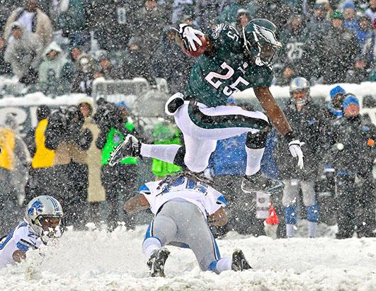 Snowy Sunday Football Picture | Players Tackle, Slide in Snowy Fields ...